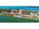 Waterfront condo complex featuring boat dock, swimming pool, and easy access to the beach at 7430 Sunshine Skyway S Ln # 402, St Petersburg, FL 33711