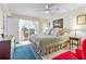 Bedroom with a balcony view, showcasing comfortable furniture and scenic outdoor access at 7430 Sunshine Skyway S Ln # 402, St Petersburg, FL 33711