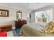 Bedroom featuring a balcony, dresser, and closet, all contributing to the space's functionality at 7430 Sunshine Skyway S Ln # 402, St Petersburg, FL 33711