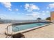 Waterfront pool with clear water, a small umbrella hut, and a paver surround at 7430 Sunshine Skyway S Ln # 402, St Petersburg, FL 33711