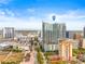 Stunning aerial view of a modern high-rise building with city views and clear blue skies at 777 N Ashley Dr # 2807, Tampa, FL 33602