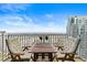 Balcony offers comfortable seating and a table with views of the city skyline at 777 N Ashley Dr # 2807, Tampa, FL 33602
