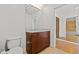 This bathroom includes a large granite-topped vanity and a glass door to the tiled shower at 777 N Ashley Dr # 2807, Tampa, FL 33602
