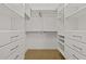 Bright walk-in closet with floor-to-ceiling adjustable shelving and drawers at 777 N Ashley Dr # 2807, Tampa, FL 33602