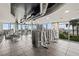 Modern condo gym with workout equipment, large windows, and city views at 777 N Ashley Dr # 2807, Tampa, FL 33602