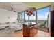 Open concept kitchen & living room with expansive windows and balcony access with beautiful city views at 777 N Ashley Dr # 2807, Tampa, FL 33602