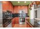 Kitchen features stainless appliances, dark countertops, and plenty of storage with wood cabinets and a wine rack at 777 N Ashley Dr # 2807, Tampa, FL 33602