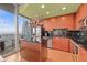 Modern kitchen with sleek black countertops, stainless steel appliances, and balcony access at 777 N Ashley Dr # 2807, Tampa, FL 33602