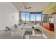 Modern living room with large windows offering stunning city views and stylish decor at 777 N Ashley Dr # 2807, Tampa, FL 33602
