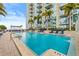 Resort-style swimming pool with lounge chairs and views of the city skyline at 777 N Ashley Dr # 2807, Tampa, FL 33602