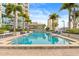 Beautiful pool surrounded by lounge chairs and palm trees on a sunny day at 777 N Ashley Dr # 2807, Tampa, FL 33602