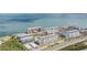 Aerial view of condo community with multiple buildings along the water at 9 Forbes Pl # 504, Dunedin, FL 34698