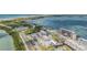 Aerial view of the building showing proximity to the bay and surrounding community at 9 Forbes Pl # 504, Dunedin, FL 34698