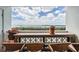 Balcony with seating and a table for enjoying the views of the bay at 9 Forbes Pl # 504, Dunedin, FL 34698