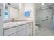 Bathroom featuring a granite vanity and walk in shower at 9 Forbes Pl # 504, Dunedin, FL 34698
