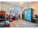 Sunlit bedroom with large window, ceiling fan and storage furniture; boxes present at 9 Forbes Pl # 504, Dunedin, FL 34698