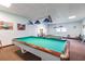 Spacious game room with pool tables, carpeted floors, and modern lighting at 9 Forbes Pl # 504, Dunedin, FL 34698