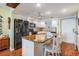 Bright kitchen boasting an eat-in breakfast bar, granite countertops and modern appliances at 9 Forbes Pl # 504, Dunedin, FL 34698