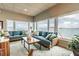 Beautiful living room with wicker sofas and bay view at 9 Forbes Pl # 504, Dunedin, FL 34698