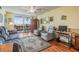 Comfortable living room area with balcony access and views of the water at 9 Forbes Pl # 504, Dunedin, FL 34698