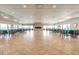 Expansive meeting room with tile floors, large windows and a cozy fireplace at 9 Forbes Pl # 504, Dunedin, FL 34698