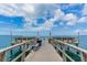 View of pier with benches and railings on the bay at 9 Forbes Pl # 504, Dunedin, FL 34698