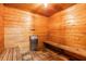Inviting sauna room showcasing wood paneled walls, wooden floors, and a built in bench at 9 Forbes Pl # 504, Dunedin, FL 34698
