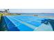 Blue shuffleboard court with the bay in the background at 9 Forbes Pl # 504, Dunedin, FL 34698