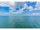 Scenic water view with peaceful horizon and scattered clouds providing tranquility for area residents at 9 Forbes Pl # 504, Dunedin, FL 34698