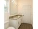 Bright bathroom featuring a double vanity with granite countertops, and contemporary lighting at 9002 Glenarm Way, Spring Hill, FL 34613