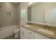 Bathroom featuring a double vanity with granite countertops, a bathtub, and modern fixtures at 9002 Glenarm Way, Spring Hill, FL 34613