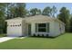 Charming single-Gathering home with a two-car garage and manicured front lawn at 9002 Glenarm Way, Spring Hill, FL 34613