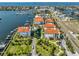 Aerial image of a condo community offering waterfront views, boat docks, and a community pool in Florida at 1038 Bellasol Way # 202, Apollo Beach, FL 33572