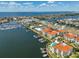 Aerial view of waterfront condos, community pool, and boat docks, highlighting location and amenities at 1038 Bellasol Way # 202, Apollo Beach, FL 33572