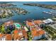 Stunning aerial shot of condos with boat docks, waterfront views, and a refreshing community pool at 1038 Bellasol Way # 202, Apollo Beach, FL 33572