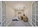 Inviting bedroom with neutral colors and a dedicated workspace, ideal for study and relaxation at 1038 Bellasol Way # 202, Apollo Beach, FL 33572