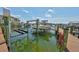 Waterfront home with a private dock and boat lift, ideal for boating enthusiasts with easy access to open water at 1038 Bellasol Way # 202, Apollo Beach, FL 33572