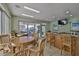 Common area with tv, kitchenette, bar, and access to outdoor seating at 1038 Bellasol Way # 202, Apollo Beach, FL 33572