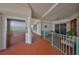 Hallway providing access to exterior terrace space, an elevator, and a condo entrance at 1038 Bellasol Way # 202, Apollo Beach, FL 33572