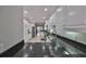 Contemporary kitchen with stainless steel appliances, granite countertops, and ample cabinet space at 1038 Bellasol Way # 202, Apollo Beach, FL 33572