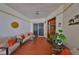 Cozy living room features tile floors, comfortable seating, and charming coastal decor at 1038 Bellasol Way # 202, Apollo Beach, FL 33572