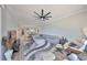 Large living room flows into the dining area, featuring neutral decor and stylish furnishings at 1038 Bellasol Way # 202, Apollo Beach, FL 33572