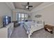 Serene main bedroom with waterfront views and a private balcony at 1038 Bellasol Way # 202, Apollo Beach, FL 33572