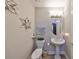 Charming powder room featuring modern fixtures and decor at 1038 Bellasol Way # 202, Apollo Beach, FL 33572
