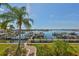 Waterfront property featuring docks and lush landscaping at 1038 Bellasol Way # 202, Apollo Beach, FL 33572