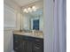 Stylish bathroom featuring granite countertops, modern vanity and ample lighting at 12037 Conway St, Spring Hill, FL 34609