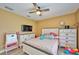 Comfortable bedroom with a well-lit interior and a ceiling fan for added comfort at 12037 Conway St, Spring Hill, FL 34609