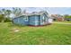 Charming one-story home featuring a well-manicured lawn and attractive exterior paint at 12037 Conway St, Spring Hill, FL 34609