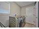 Efficient laundry room with a modern washer and dryer set at 12037 Conway St, Spring Hill, FL 34609