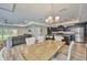 Spacious open-concept featuring a well-appointed kitchen, dining area, and comfortable living room at 12037 Conway St, Spring Hill, FL 34609